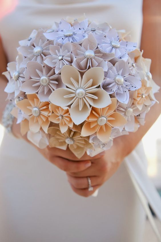 a paper flower wedding bouquet of note paper and pearls for a chic look and a music loving bride