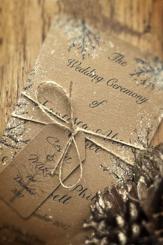 simple cardboard wedding invites with snow and twine look rustic and cozy