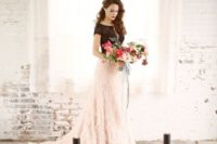 06 the bride wearing a black lace top and a feather blush skirt for a glam feel