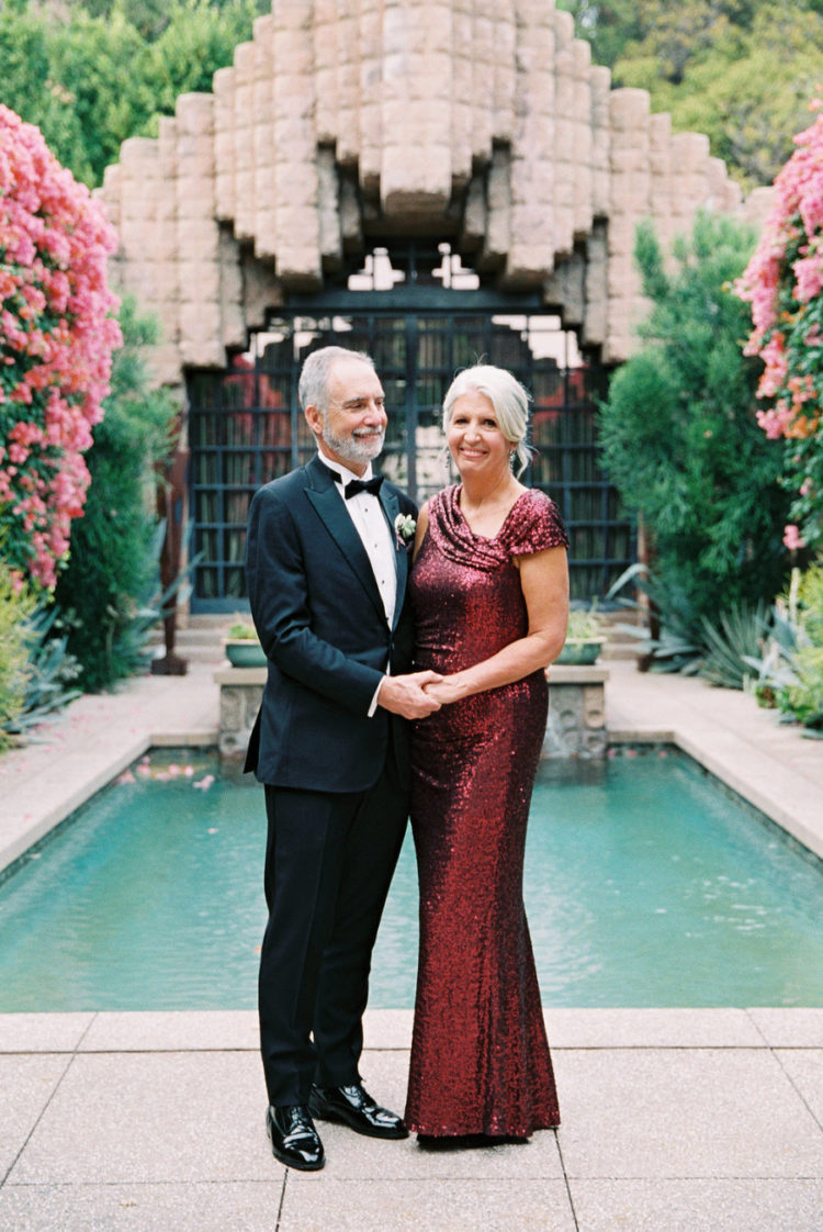 The groom's parents look really glam and chic - look at that red sequin dress