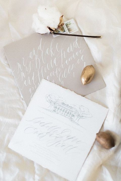 grey and white wedding invites with calligraphy remind of snowy months