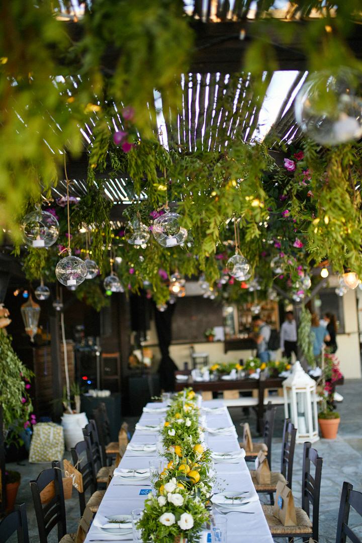The lush greenery hanging from above, candle lanterns and flowers made the reception more welcoming
