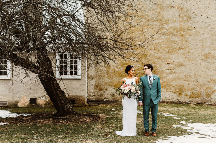 After that the couple dressed up into more European clothes - the groom was wearign a seafoam green suit and the bride was wearing a modern wedding gown