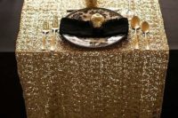 09 a gold sequin table runner for a black and gold wedding tablescape