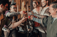 10 Groomsmen drinking with the groom