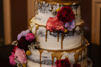 10 The wedding cake was a naked one, with salty caramel drip and bold blooms on top