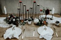 10 The wedding tablescape was done with a lace runner, metal candle holders, geo details and gold for a more refined feel