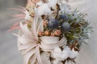 10 organic winter wedding bouquet with air plants, blue thistles, and cotton
