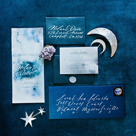 starry night themed wedding stationery with watercolor teal and grey invites and blue and teal envelopes