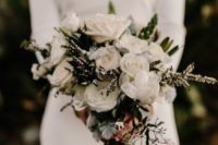 13 a modern bouquet with white roses, evergreens and foliage for a textural look