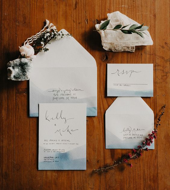 coastal watercolor blue wedding invitations with black letters look minimal and stylish
