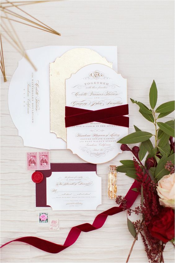 a neutral and burgundy wedidng invitation suite with velvet ribbons