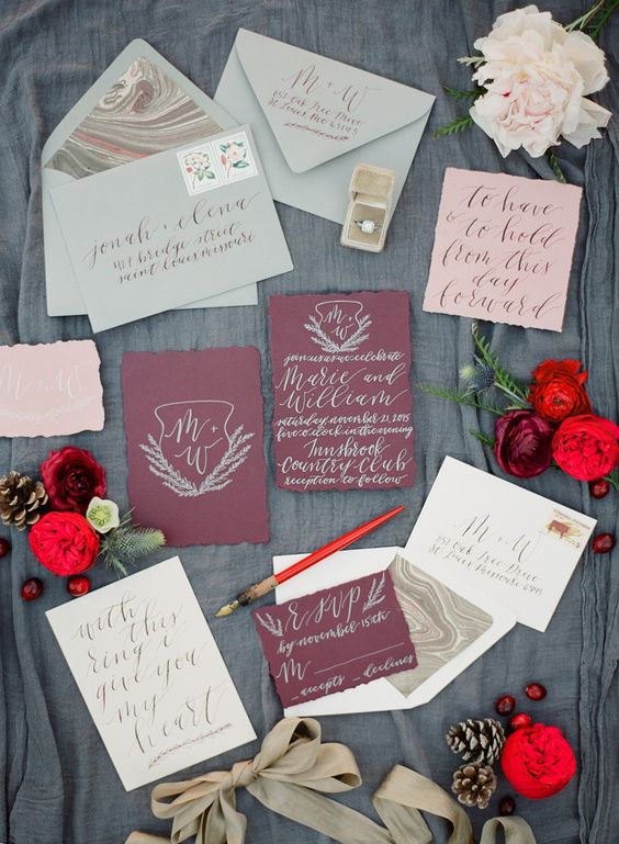a Christmas inspired wedding invitaiton set in mint, burgundy, pink and neutrals with an agate print