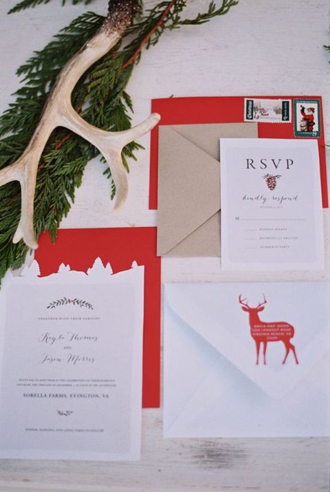 a chic traditional Christmas invitation suite with kraft paper, deer and lots of red for a bold and homey wedding