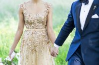 17 a sparkling gold embellished wedding gown will help you stand outin any outdoor snowy shots