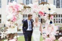 18 a gorgeous oversized paper flower wedding arch in white and pink looks wow