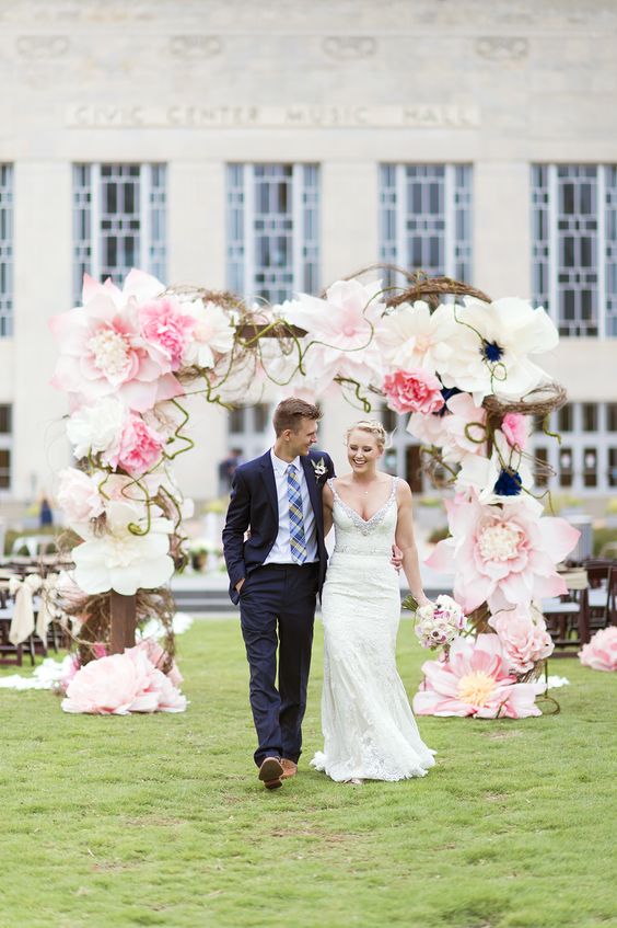 a gorgeous oversized paper flower wedding arch in white and pink looks wow