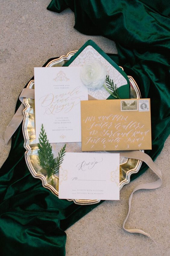 elegant gold and emerald wedding invitation suite with evergreens