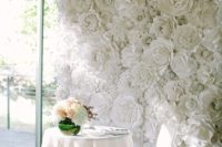 20 a white paper flower wall for the sweetheart table backdrop is a chic idea