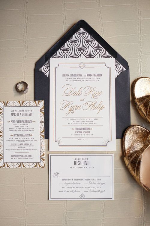 neutral wedding invites with 20s inspired prints and a navy envelope