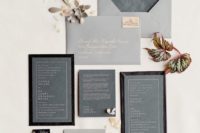 21 a modern grey and black invitation suite with pressed letters and frames for a minimalist wedding in grey shades