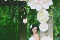24 a wedding arbor decorated with oversized blush blooms looks gorgeous