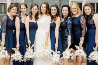 24 mismatched midnight blue dresses of various lengths and looks