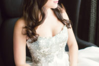 24 with a sparkling silver bodice and full silk skirt, this wedding dress is perfectly suited to a winter affair