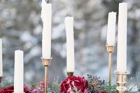 25 a pine needle and plum-colored bloom garland and candles for wedding table decor
