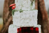 25 a woodland-inspired lumberjack wedding cake topped with edible moss and mushrooms