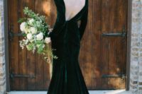 25 velvet emerald wedding dress with a train, long sleeves and an open back for a daring bride