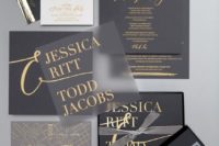26 a matte black and sheer wedding invitation set with gold letters and gold leaf decor for a bold statement