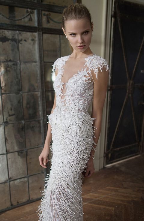 an illusion neckline wedding dress with fringe looks very playful and remind of snow flakes