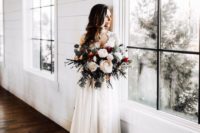 28 a gorgeous bouquet with large neutral blooms, various kinds of eucalyptus and foliage
