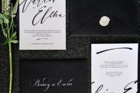 28 modern black and white wedding invitation suite with calligraphy and white wax sealing on black envelopes