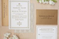 29 gold foil and white wedding invites with art deco prints and in gold envelopes