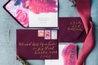 30 plum-colored envelopes, pink and purple watercolor wedding invites with gold calligraphy