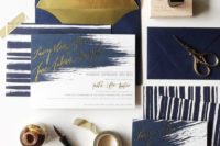 31 a navy and gold foil wedding staitonery set with brushstrokes and stripes looks unusual and modern