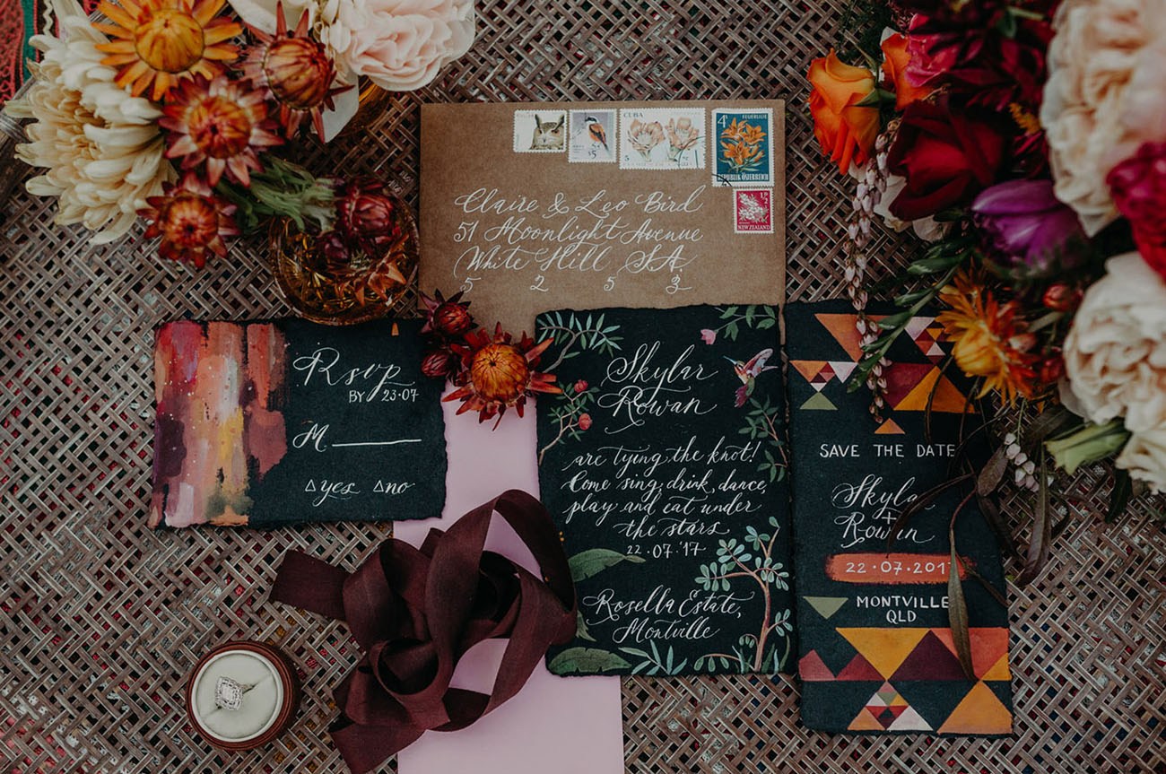 A bold stationery suite with colorful prints and tribal watercolor motifs