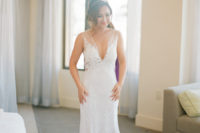 02 The bride was wearing a plunging neckline wedding dress with an illusion bodice, shoulders and back