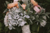 02 The wedding bouquet was done in pastel pink and orange, with pale greenery and a lace wrap