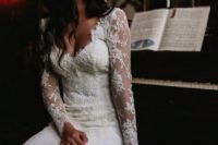 02 a beautiful lace wedding dress with a flatterign neckline, long illusion sleeves and a sexy silhouette