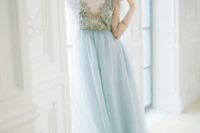02 a beautiful wedding dress with an embroidered gold top and an icy blue skirt looks chic and refined