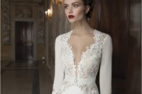 02 a chic plunging neckline wedding dress with lace inserts and long sleeves for a refined bride