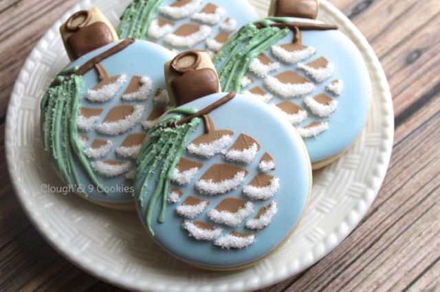 fun glazed cookies showing Christmas ornaments with pinecones are great for your guests