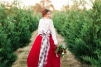 02 the bride rocking a white lace top, a red midi skirt and a plaid bow with long ends looks very Christmassy