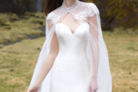 03 An elegant strapless wedding dress with a ruffled tail and a gorgeous lace beaded cape to highlight it