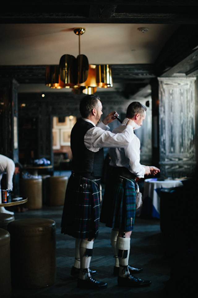 The groom and groomsmen were wearing plaid kilts, white shirts, vests and jackets