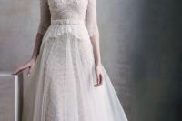 03 a beautiful vintage lace wedding dress with a turtleneck, half sleeves and an overskirt looks very delicate