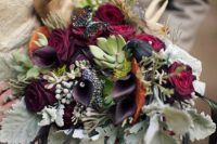03 a bold boho wedding bouquet with deep plum blooms, pale greenery and antlers